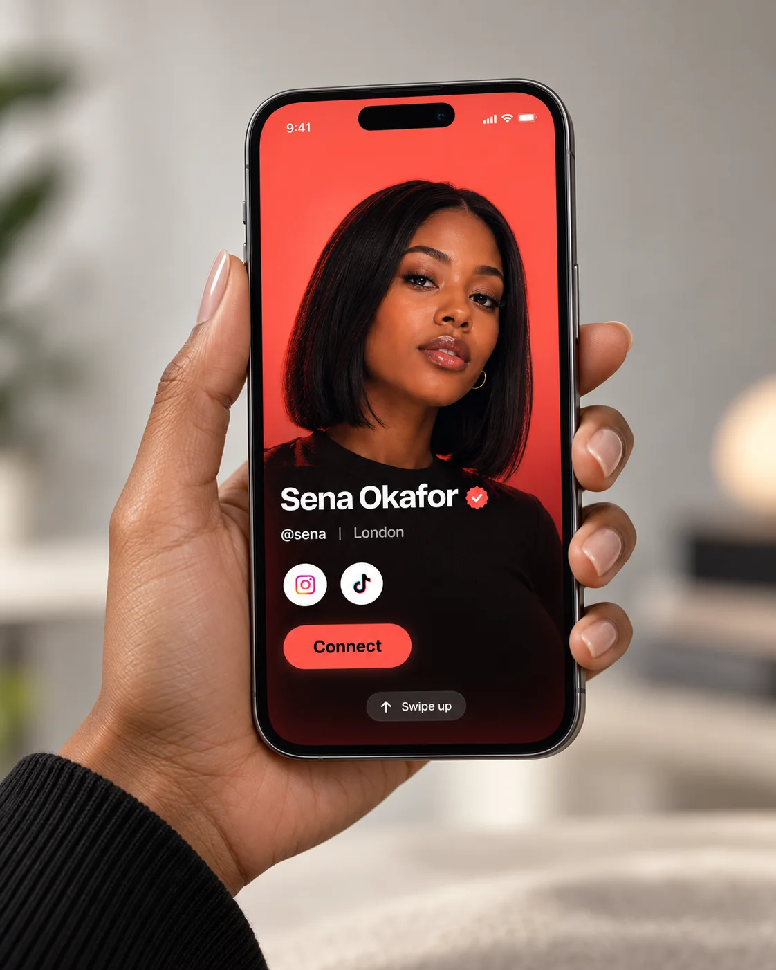 A hand holding a phone showing Sena Okafor’s Setuvara identity